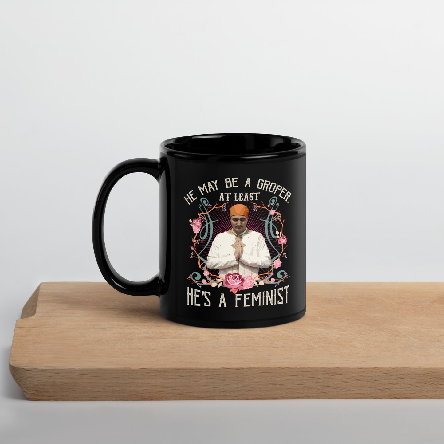 He May Be a Groper, At Least He's a Feminist. Black Glossy Mug